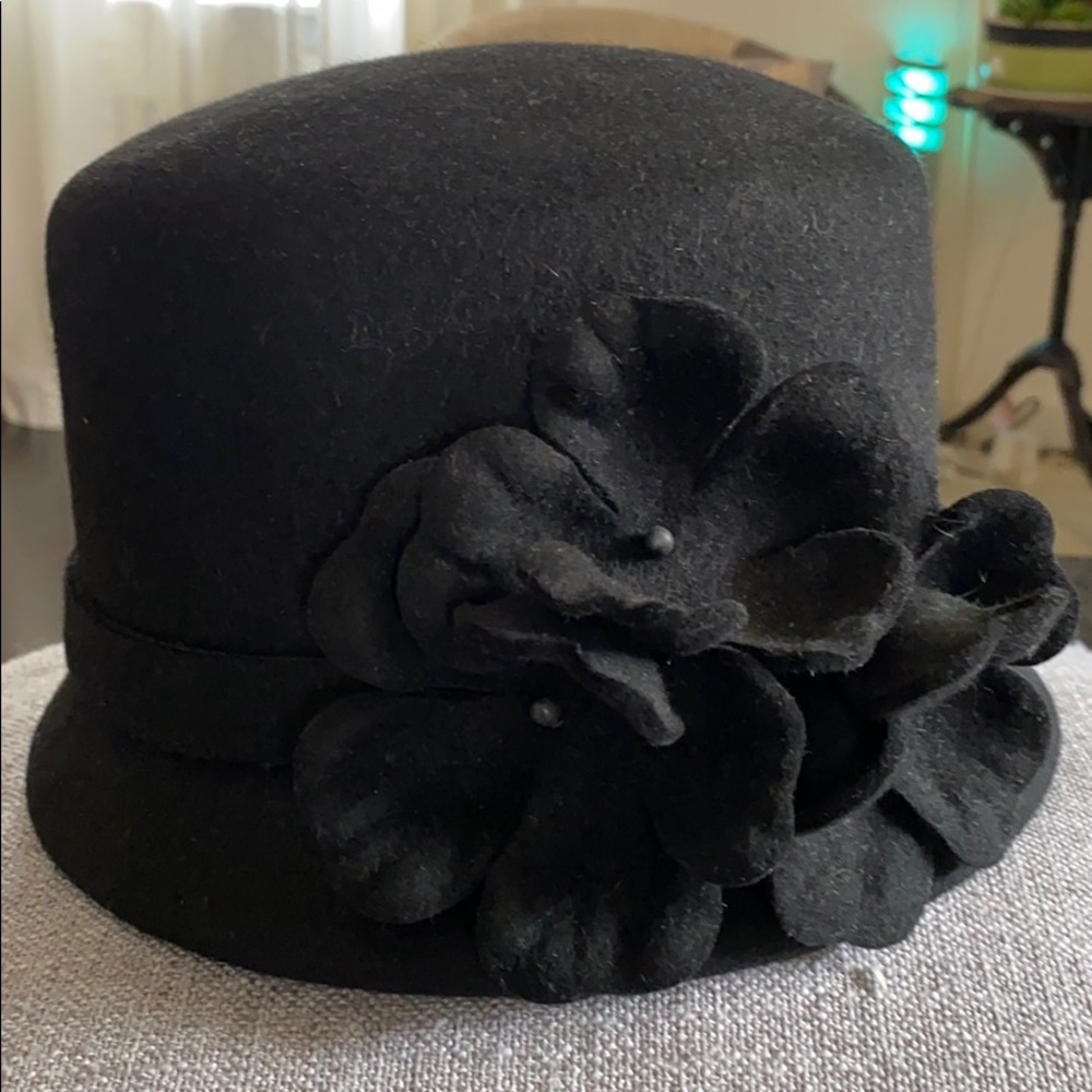 Black bowler hat with flowers.